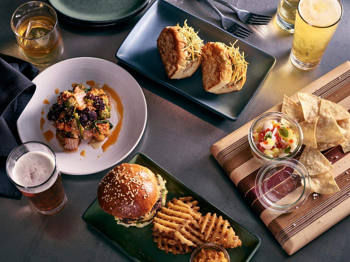 Merchant & Trade is reopening with a smaller menu that includes customers’ favorite snacks and sandwiches, along with a variety of housemade cocktails, draft beer and wine.