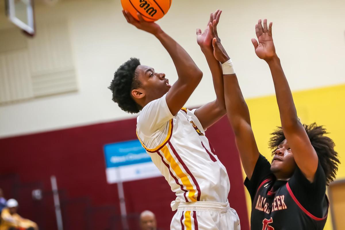 West Charlotte senior forward Riley Faison pulls up at center court to shoot a floater to during the third quarter at West Charlotte high school in Charlotte, N.C. on December 17th, 2024