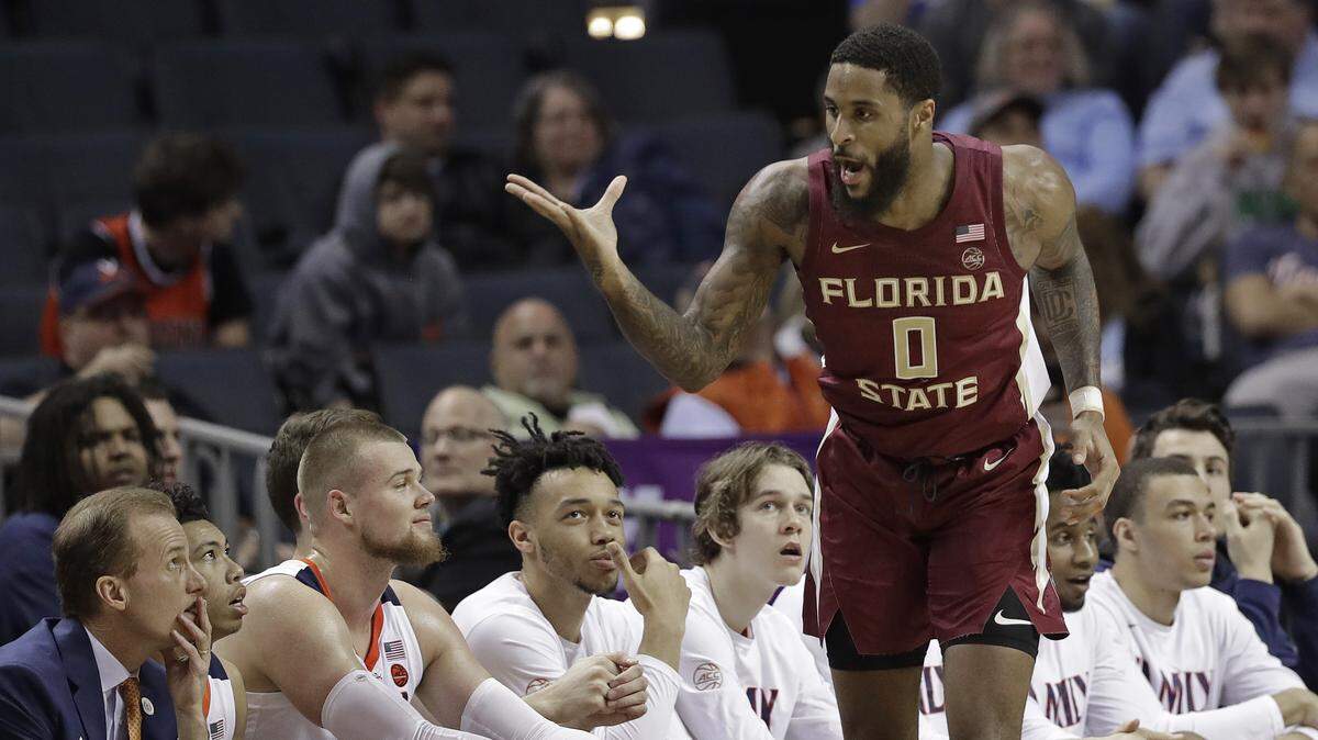 Florida State’s Phil Cofer (0) blew a kiss to the Virginia bench during the Seminoles’ upset win over the Cavaliers in the ACC Tournament semifinals Friday night.
