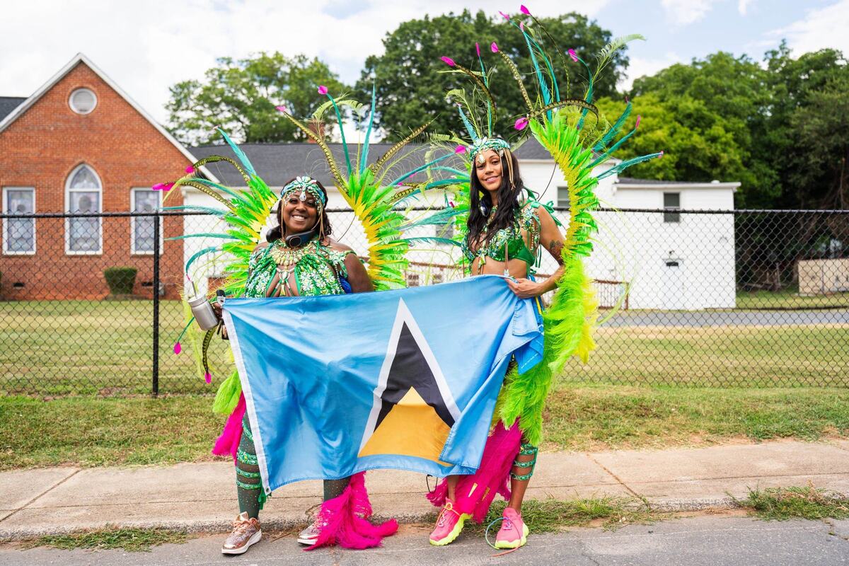 Eve Joseph, left, and Laura Jean, both of Atlanta and natives of St. Lucia, participated in the 4th annual Charlotte Caribbean Carnival parade on June 29, 2024.
