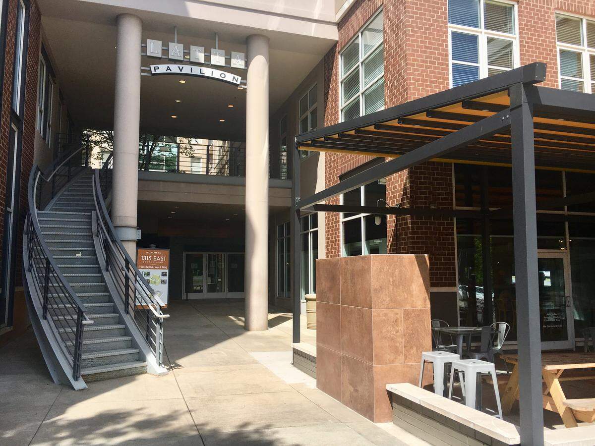 If you look hard behind the Pavillion arch, you can see the doors for the Queen and Glass, tucked in beside The People's Market.