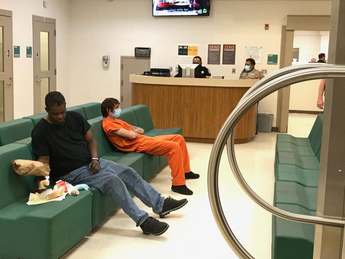 These two recently arrested men were waiting to see a magistrate inside Mecklenburg Jail Central.