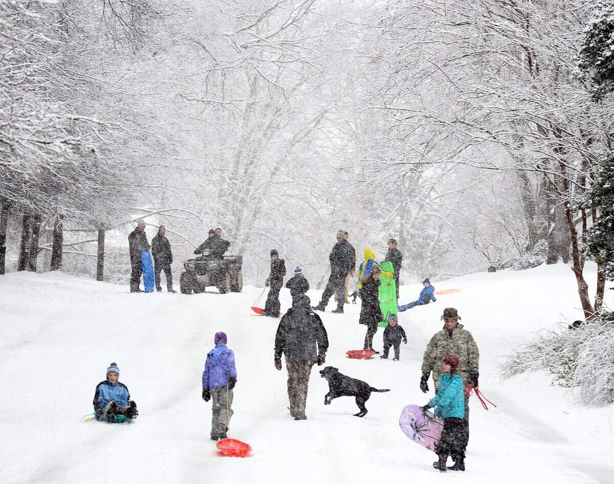 Children and adults had fun playing in the snow on Thursday, Feb. 13, 2014, as schools and most businesses were closed. That week, Charlotte got more than 8 inches of snow.