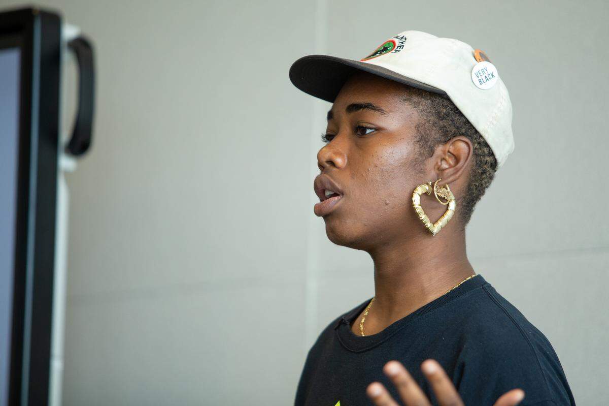 Photographer Shan Wallace of Baltimore is the current artist-in-residence at The Roll Up CLT. Here, she’s speaking to a group at the Beatties Ford library branch. While in Charlotte, Wallace will teach photography, hold free portrait sessions at the library, conduct various workshops, and use her art to help build community on the west side.