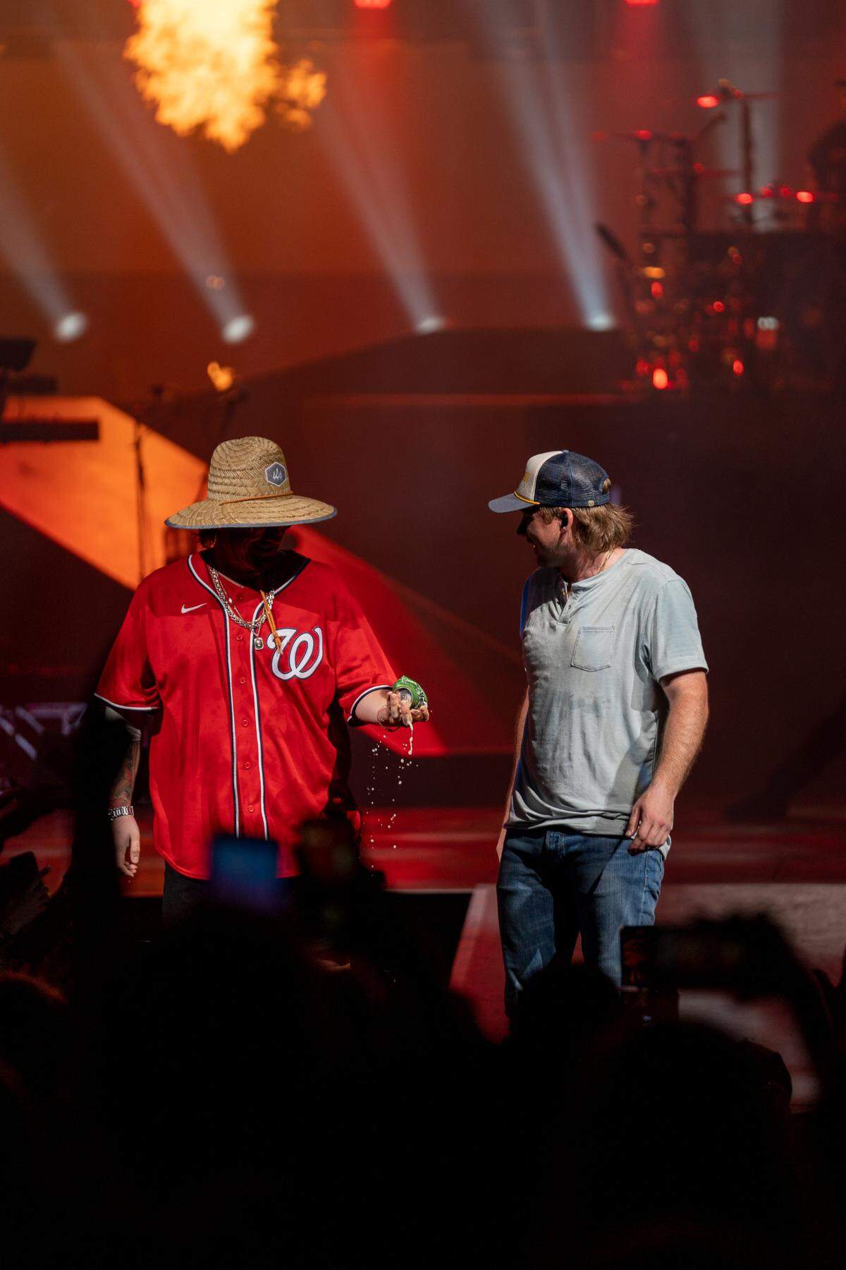 Morgan Wallen, right, with opening act HARDY, after the two shotgunned cans of beer during Wallen’s “Dangerous Tour” on Thursday night at PNC Music Pavilion.