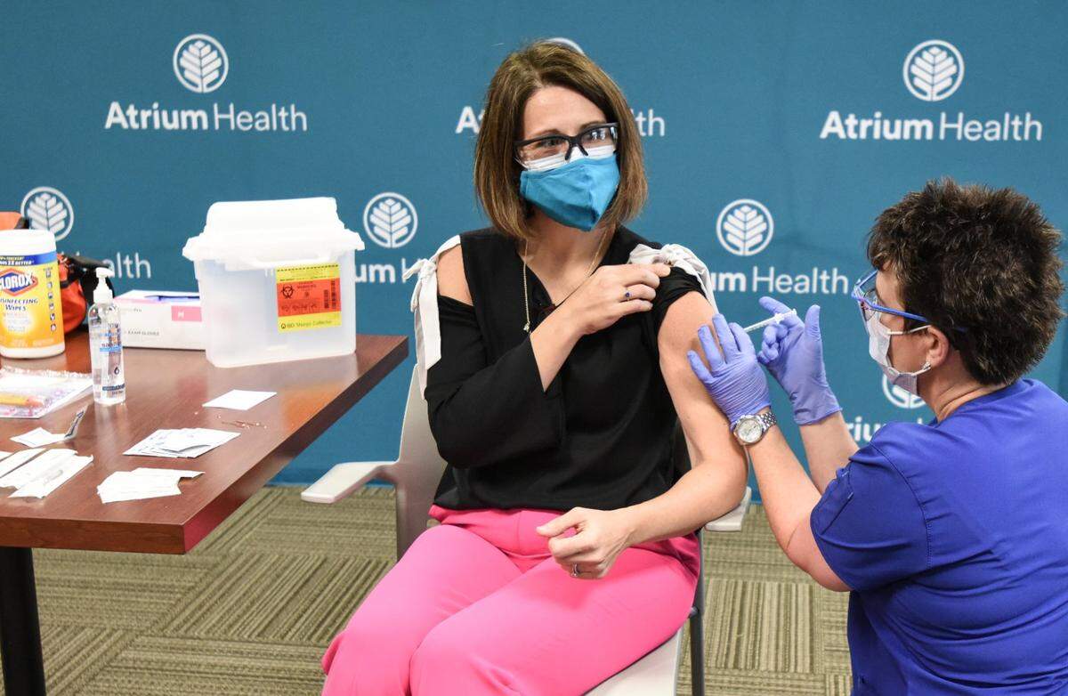 Dr. Katie Passaretti, the medical director of infection prevention at Atrium Health in Charlotte, was the first to receive a vaccination there.
