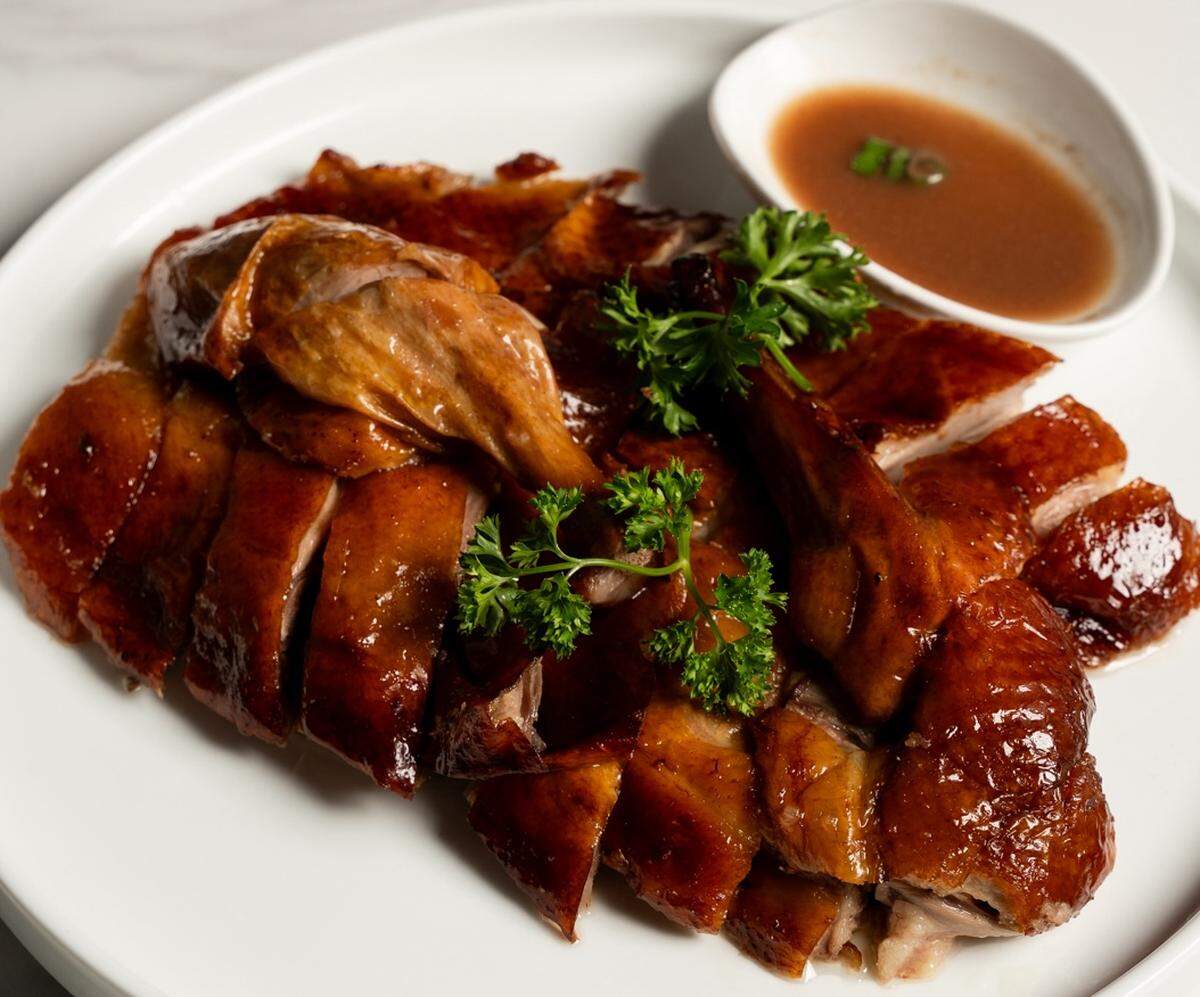 Flame Bistro & Bar’s Crispy-Skin Roast Duck. 