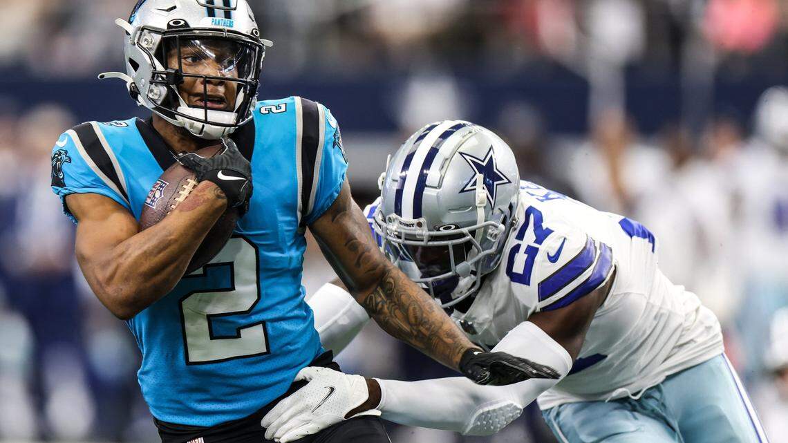 Carolina Panthers D.J. Moore, left, is tackled by Dallas Cowboys Jayron Kearse at the AT&T Stadium in Arlington, T.X., on Sunday, October, 3, 2021.