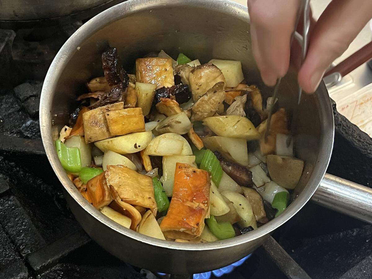 Once the mushrooms have softened, chef Sam Diminich adds the mirepoix to further cook down.