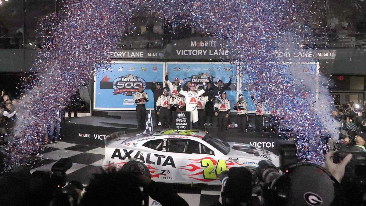 William Byron stands on his no. 24 Chevrolet in Victory Lane, Monday night February 19, 2024 after winning the Daytona 500.