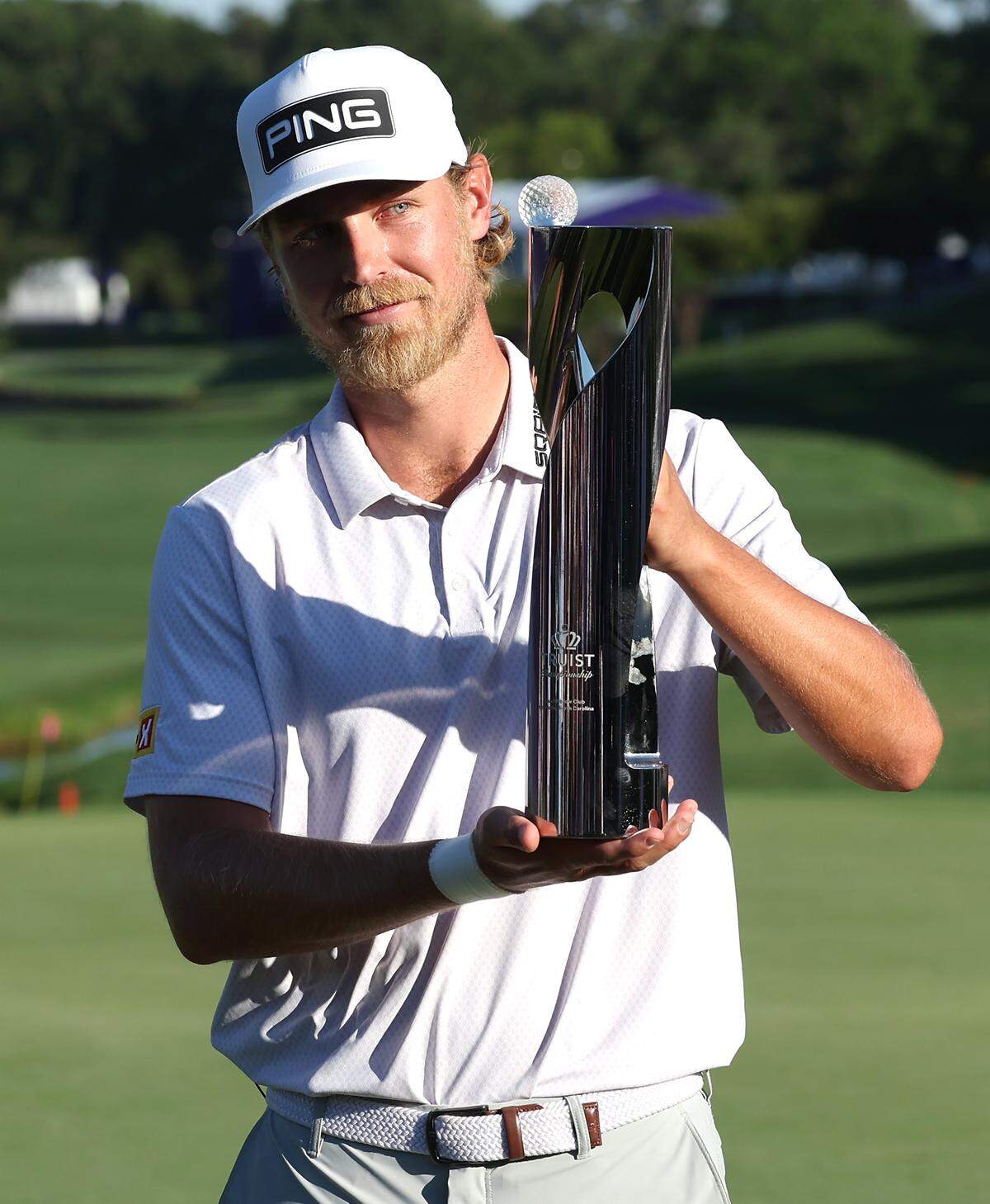 Golfer Kristoffer Reitan poses with the Truist Championship trophy at Quail Hollow Club in Charlotte, NC on Sunday, May 10, 2026. Reitan won the Truist Championship finishing at -15.
