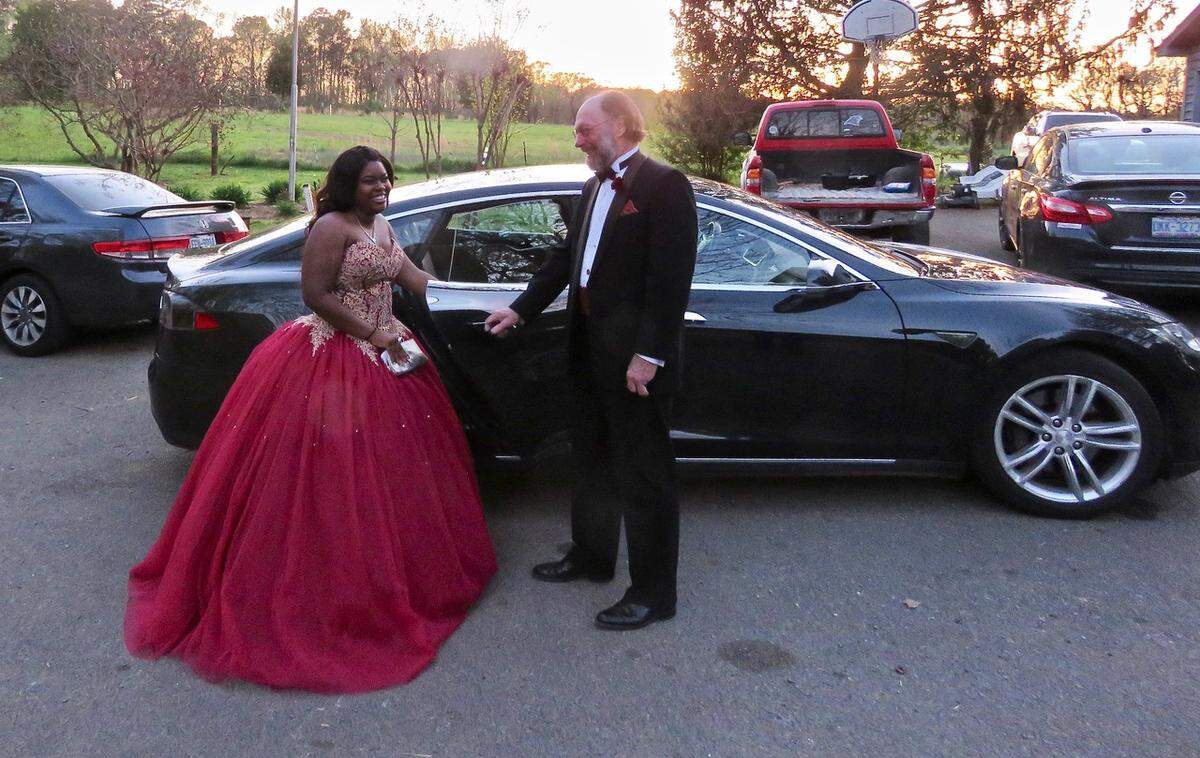 Ron with Walter’s granddaughter Danielle and the Tesla, on prom night in 2018.