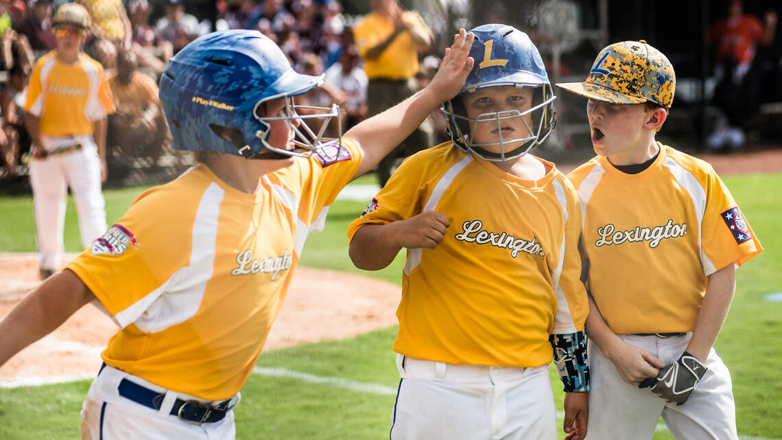 Youth baseball is scheduled to return to the Carolinas this summer — minus the handshakes
