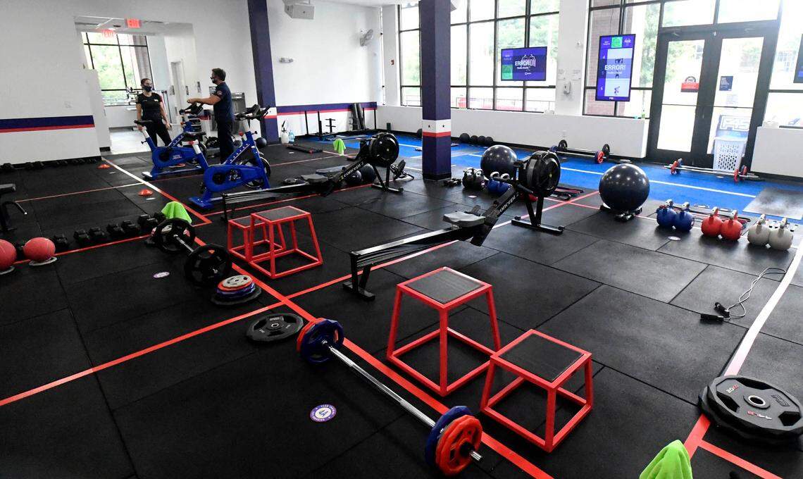 Krystal Rogers, left, Studio Manager/Head Trainer, and Jon Sayer,  owner of F45 Training’s Plaza Midwood-Belmont location in Charlotte, talk about plans to further reopen the gym on Tuesday, September 1, 2020. The state of North Carolina has moved on to the Stay at Home Phase 2.5 which will allow gyms to reopen at 30% capacity.