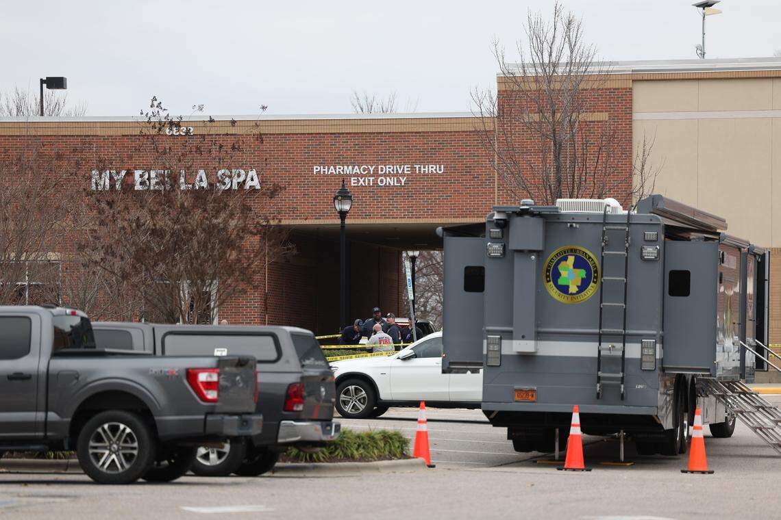 Mint Hill authorities converged on a shopping center Friday. Two officers were shot, and a suspect is dead, officials said.