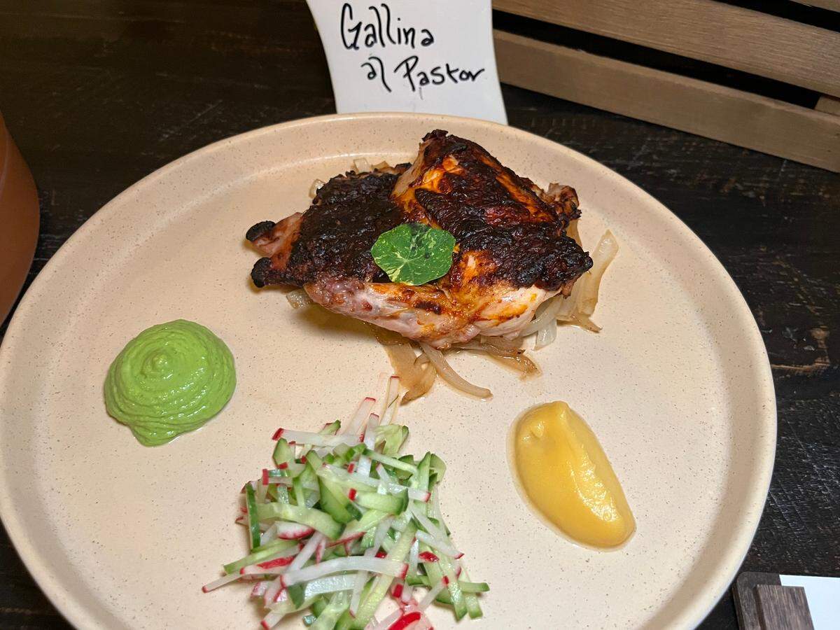 El Toro Bruto’s Gallina El Pastor is a spatchcocked Cornish game hen, rubbed in red adobo and placed over a bed of caramelized onions, served with pineapple emulsion and avocado serrano mousse ($24). 