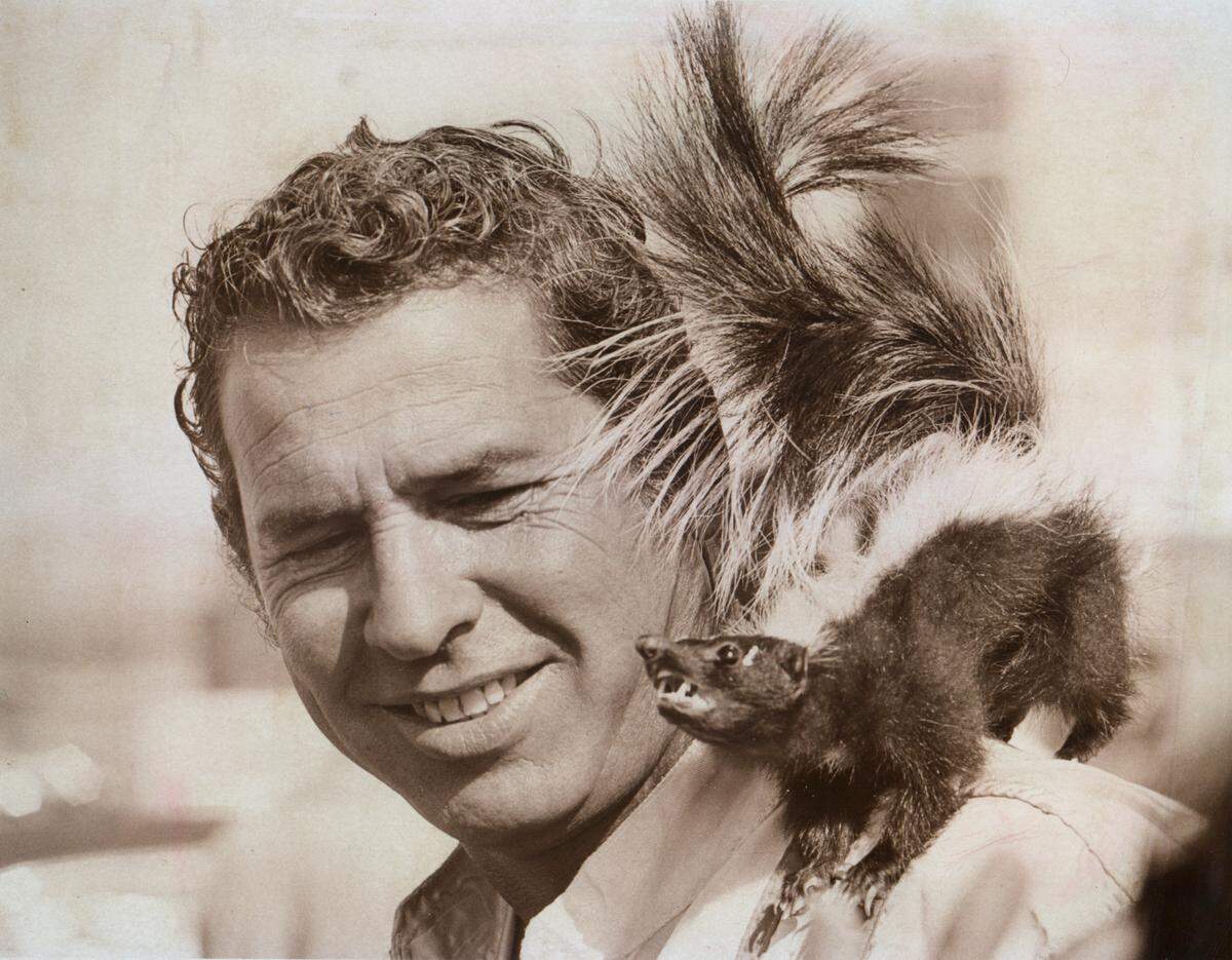 After winning the pole for the World 600 race at Charlotte Motor Speedway in May 1974, David Pearson posed with a skunk on his shoulder.