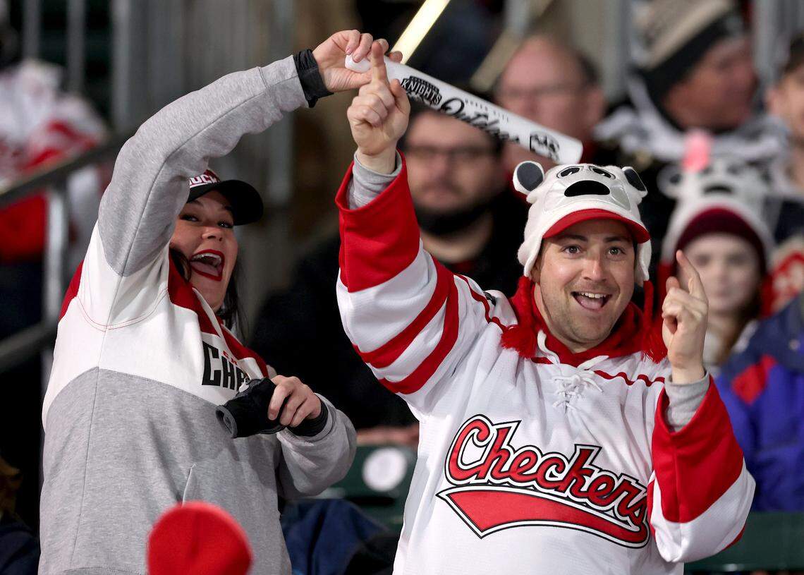 Charlotte Checkers fans dance in the aisle as they prepare for the team to battle the Rochester Americans in the 2024 Queen City Outdoor Classic at Truist Field in uptown Charlotte, NC on Saturday, January 13, 2024.