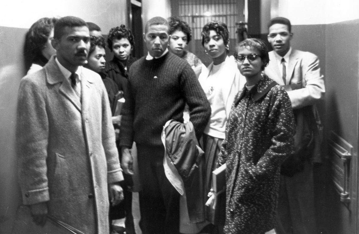 On Feb. 12, 1960, 41 students from Shaw University and St. Augustine’s College were arrested on trespassing charges at Cameron Village in Raleigh after refusing a request to leave by an official with the shopping center. The students had earlier staged a sit-in at the F.W. Woolworth lunch counter at Cameron Village. George Greene, left, a Raleigh lawyer, met with some of the arrested students at the Wake County jail. The protest was among a wave of demonstrations that followed a lunch counter sit-in on Feb. 1, 1960, by four N.C. A&T State University students at Woolworth in Greensboro.