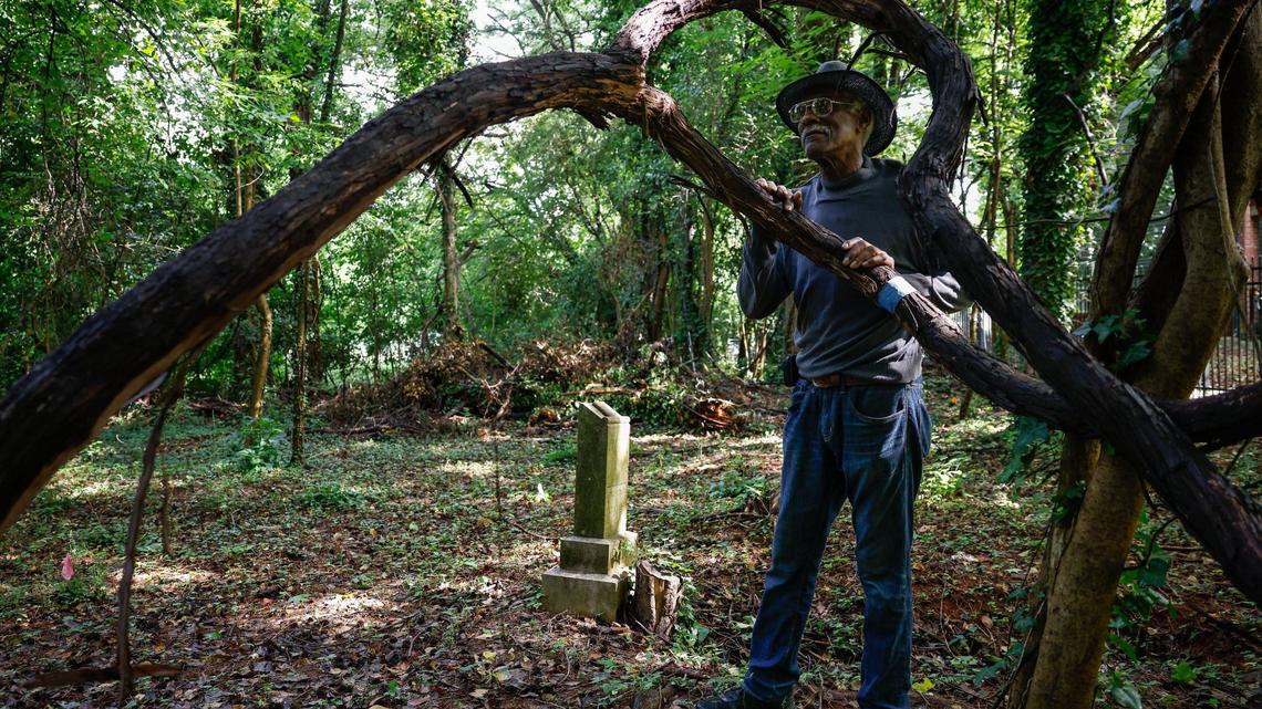 “We used to swing on these [vines] when we were little,” says Wayne Johnson, Vice President of the St. Lloyd Presbyterian Cemetery Foundation. “This is going to be part of the art in our cemetery,” Johnson continues when talking about plans to keep vines in place during the renovation of one of St. Lloyd Presbyterian’s cemeteries in the Grier Heights neighborhood in Charlotte on Monday, July 8, 2024.