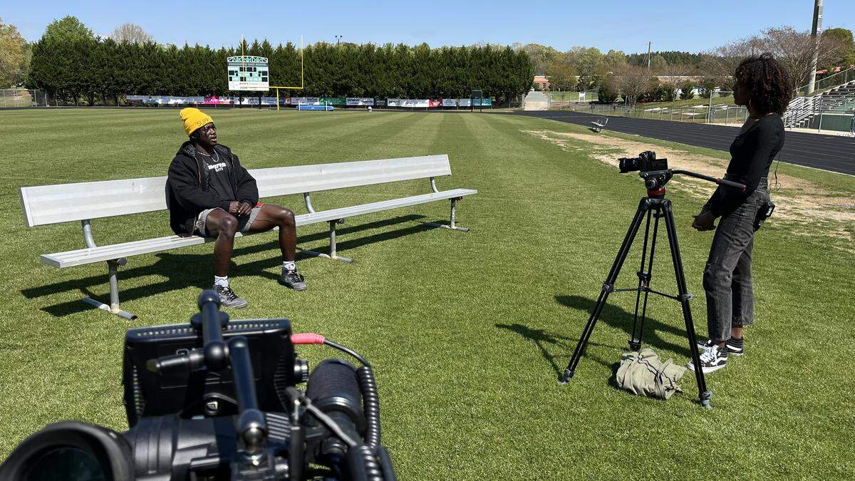 WSOC sports reporter DaShawn Brown interviews former Weddington High defensive back Malik Mustapha in 2024.