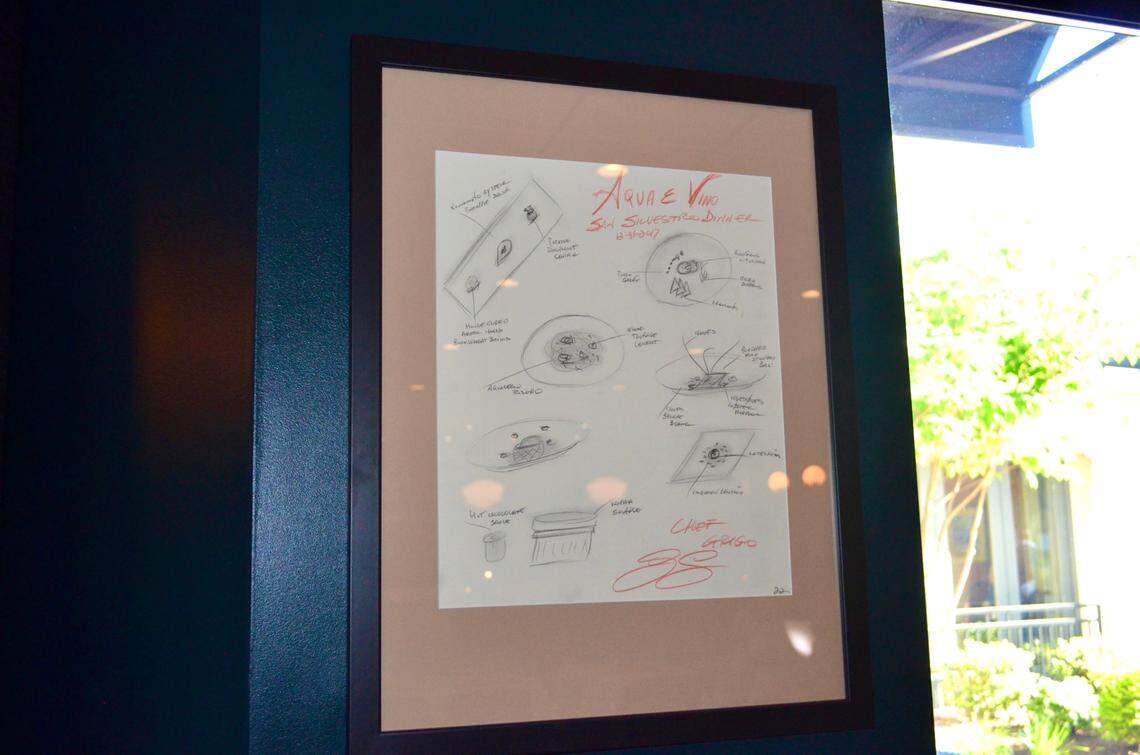 The handwritten menu from New Year’s Eve 2017 hangs on the wall as decor at Aqua e Vino.