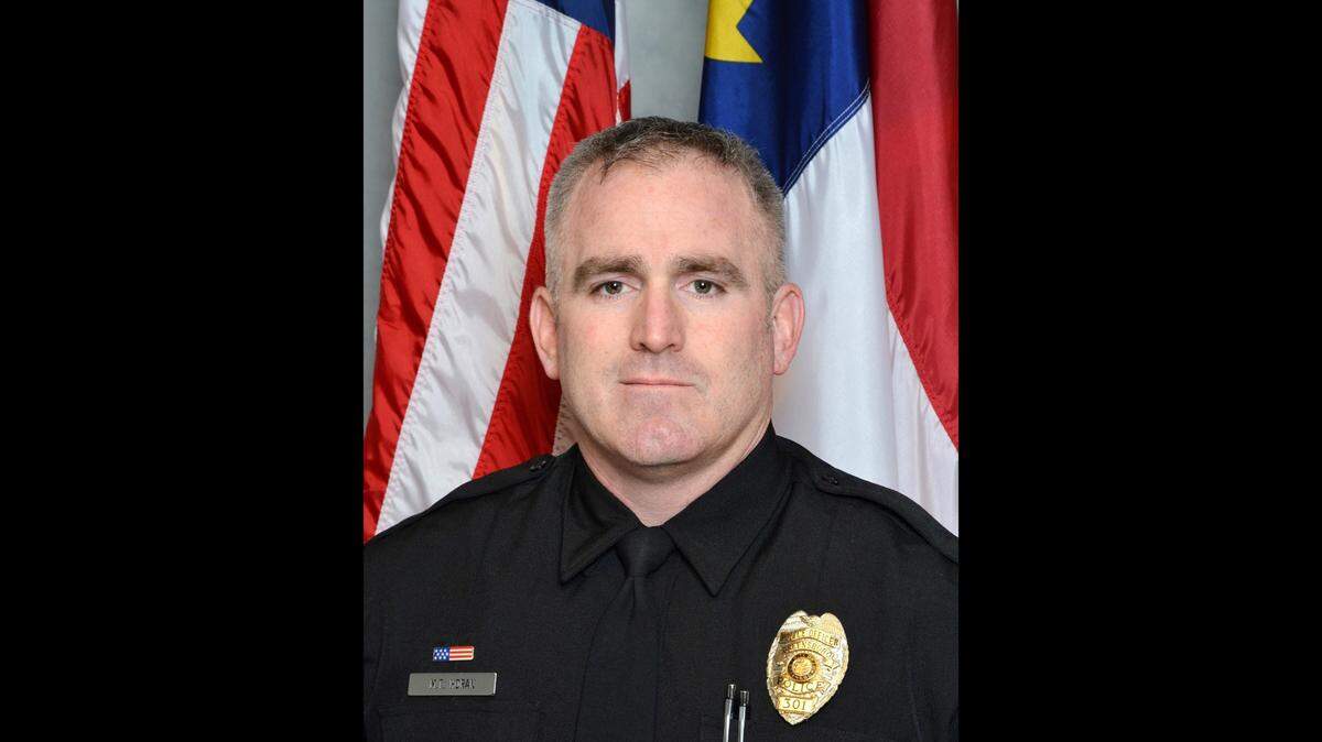 Officer Michael Horan was fatally shot Monday, Dec. 23 while responding to reports of a man with a gun at a Food Lion in North Carolina, the Greensboro Police Department said.
