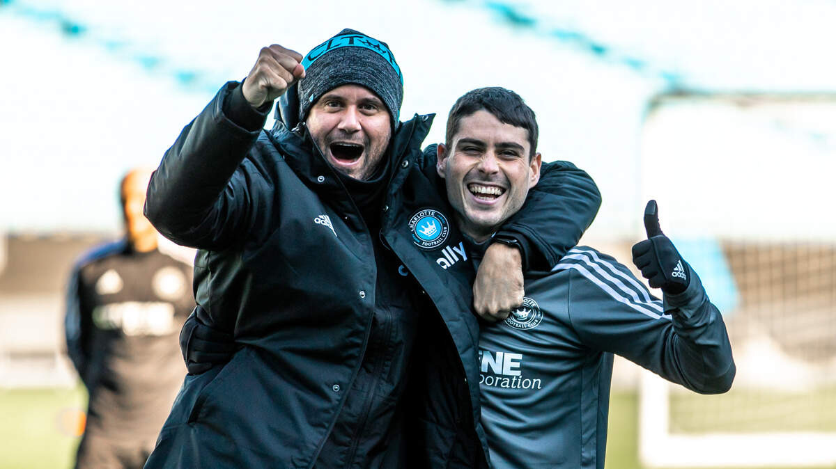 Charlotte FC head coach Miguel Ángel Ramírez embraced central midfielder Sergio Ruiz prior to training at Bank of America Stadium on Jan. 24.