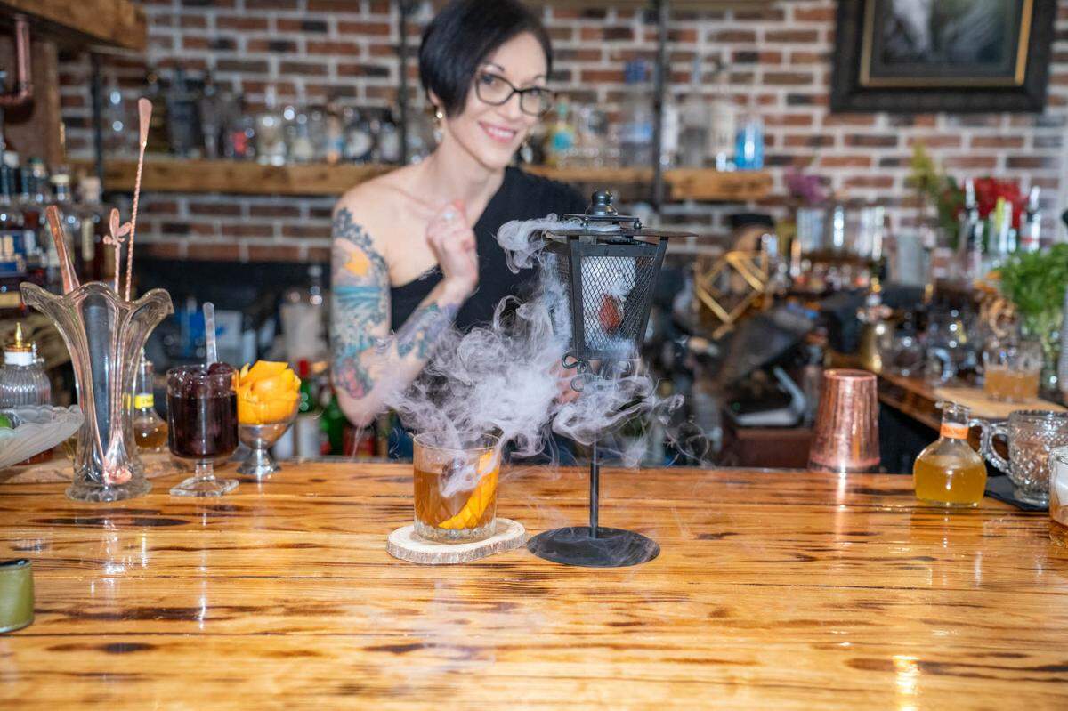 Dana Jordan creates creative cocktails behind the bar at Barrel & Fork.