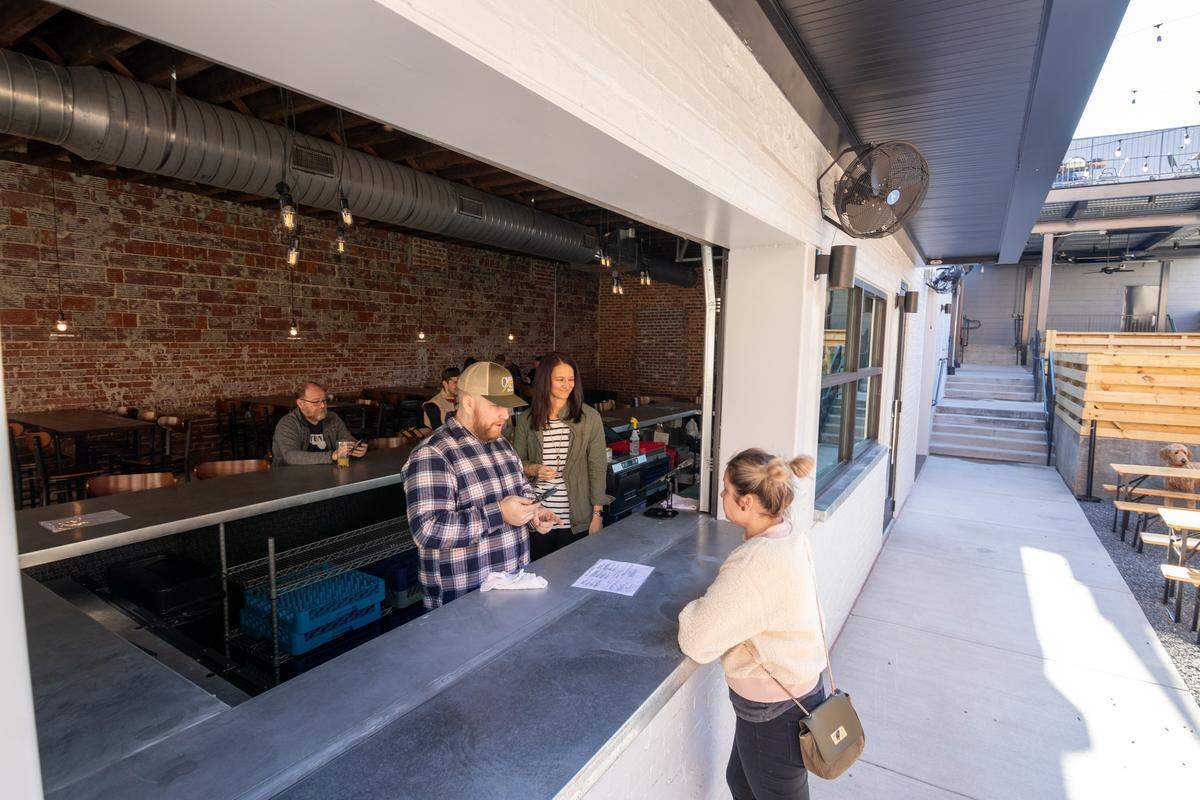 Devil’s Logic Brewery has an open window for bartenders to serve indoors and outdoors.
