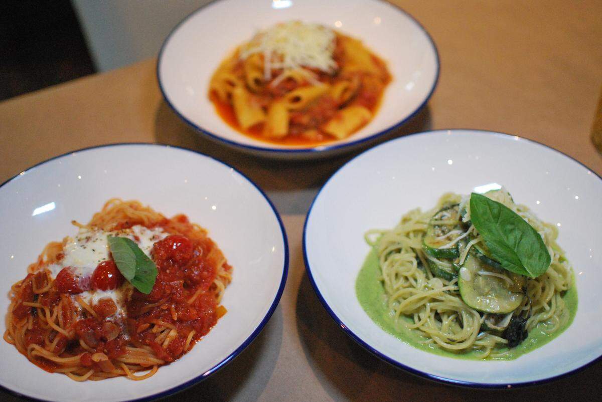 Fontana di Vino offers a variety of pasta choices, including Spaghetti Pomodoro (left); Spaghetti alla Nerano (right), with roasted zucchini, basil and pecorino Parmesan; and Rigatoni Sugo, with slow-cooked pork in red wine and marinara.