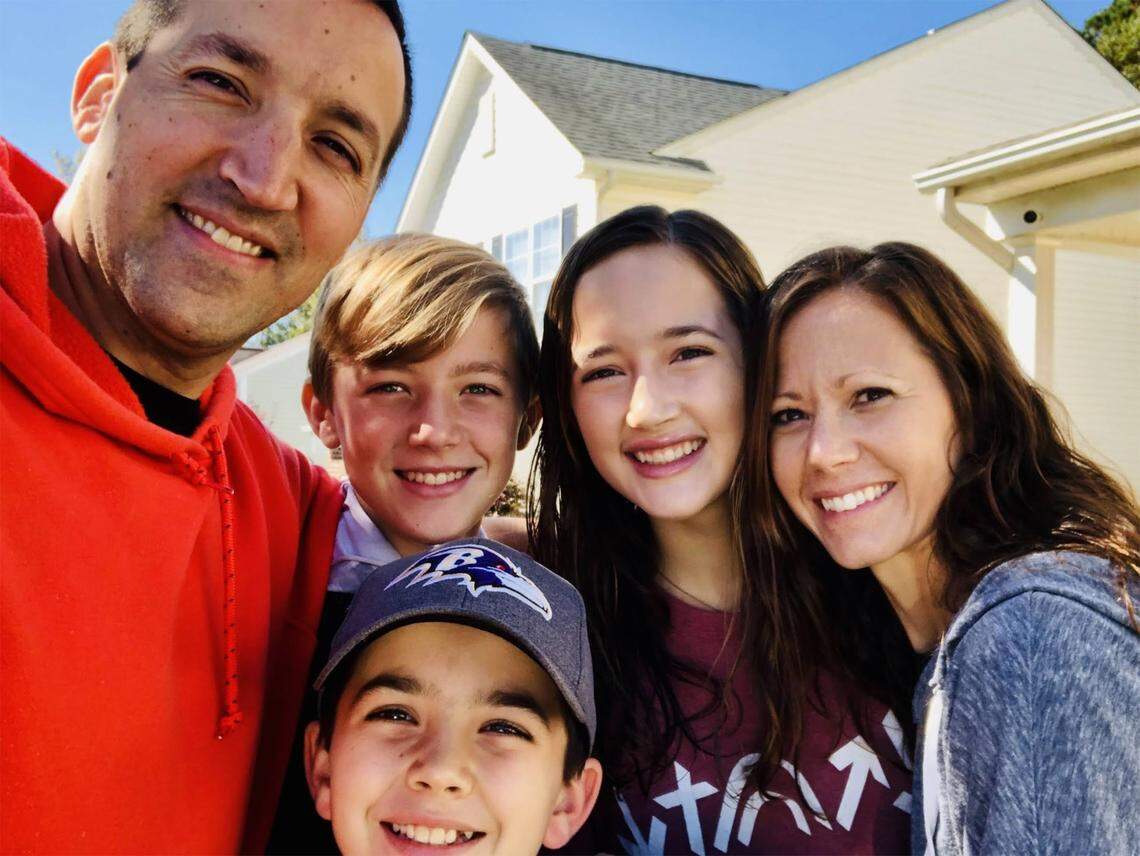The Armstrong family — from left, Kevin, Ben, 13, Sammy (in ballcap), 11, Ellie, 15, and Holly — in a photo taken right before Kevin and Holly got into the car to drive to Atlanta for the surgery.