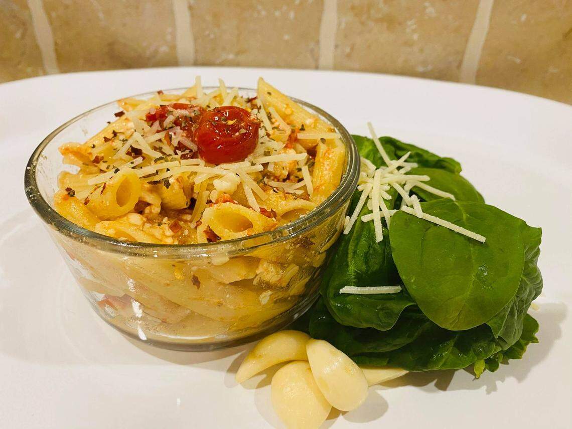 People are modifying the viral TikTok recipe for feta pasta with garlic, basil and even chicken.