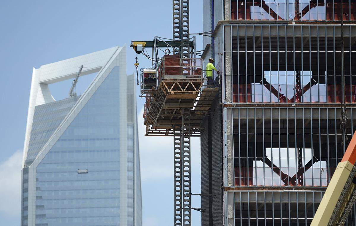 A looming trade war where tariffs on products like steel and soybeans are raising prices and threatens to hurt U.S. businesses and farmer. Just south of uptown Charlotte construction continued at The Railyard Southend on Tuesday, July 10, 2018. 
