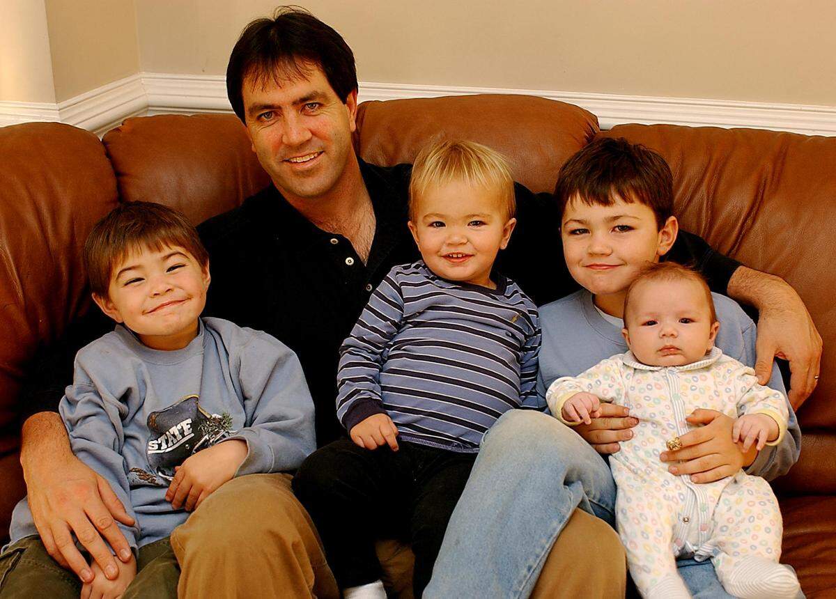 Mark Maye is surrounded by his four young boys in a 2002 Charlotte Observer photo. From left to right: Cole (age 4), Beau (age 1), Luke (age 5) and Drake (3 months).