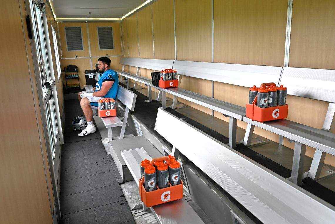 Carolina Panthers guard J.D. DiRenzo sits in the cooling trailer prior to the start of practice on Tuesday, August 6, 2024.