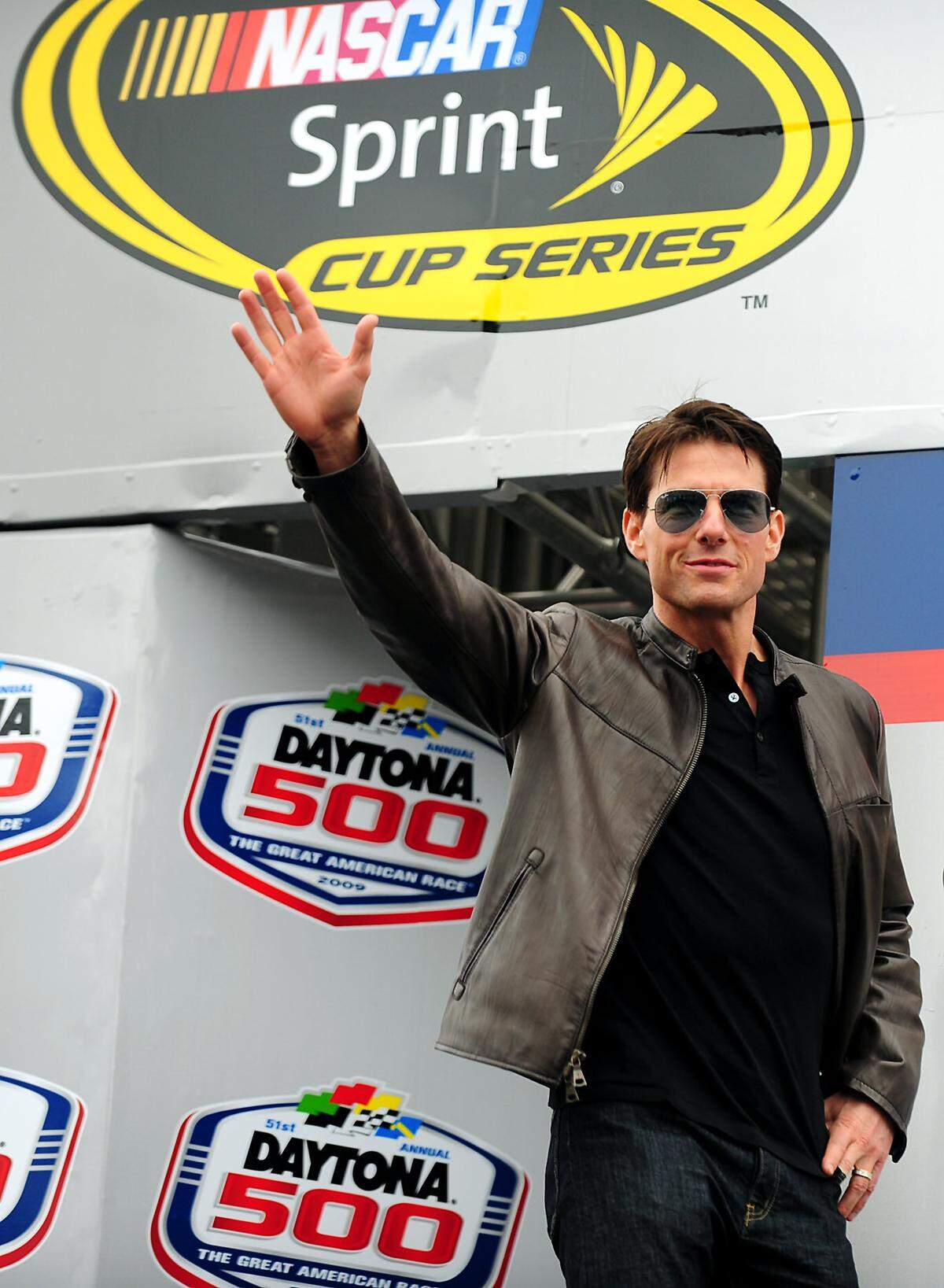 In 2009, actor Tom Cruise waved to the fans before the Daytona 500 in Florida. Cruise has long been associated with NASCAR, ever since he starred in the 1990 NASCAR movie “Days of Thunder.”