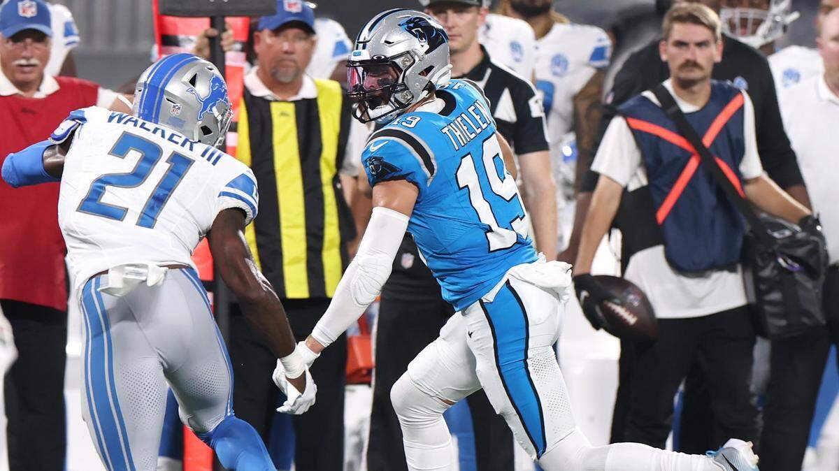 Carolina Panthers wide receiver Adam Thielen, right, breaks to the outside following a pass reception for yardage as Detroit Lions safety Tracy Walker, left, looks to make the tackle during first quarter action on Friday, August 25, 2023 at Bank of America Stadium in Charlotte, NC.