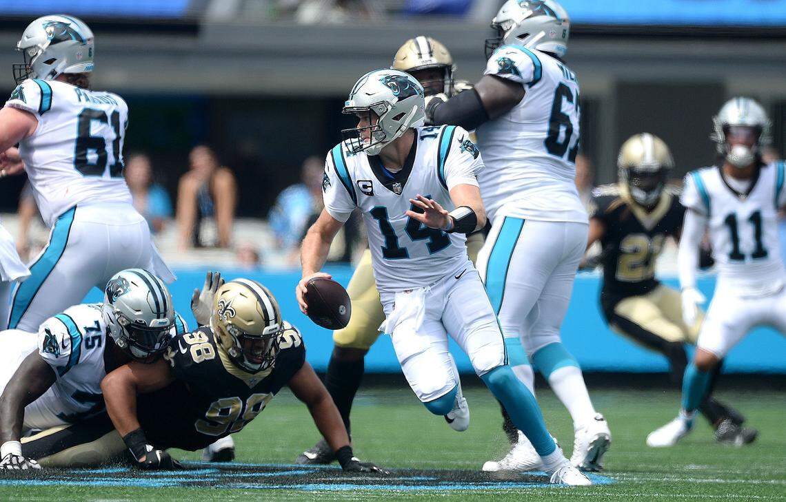 Carolina Panthers quarterback Sam Darnold rolls out of the pocket against New Orleans on Sept. 19. In what was Darnold’s best game of the season, he threw for 305 yards and two TDs in a 26-7 Carolina win.