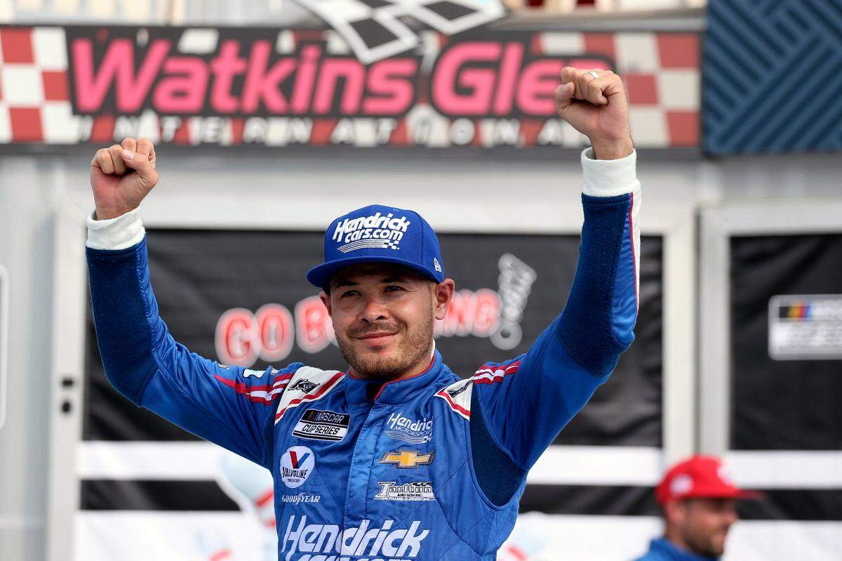 Kyle Larson celebrates winning a NASCAR Cup Series auto race in Watkins Glen, N.Y., on Sunday, Aug. 8, 2021. (AP Photo/Joshua Bessex)