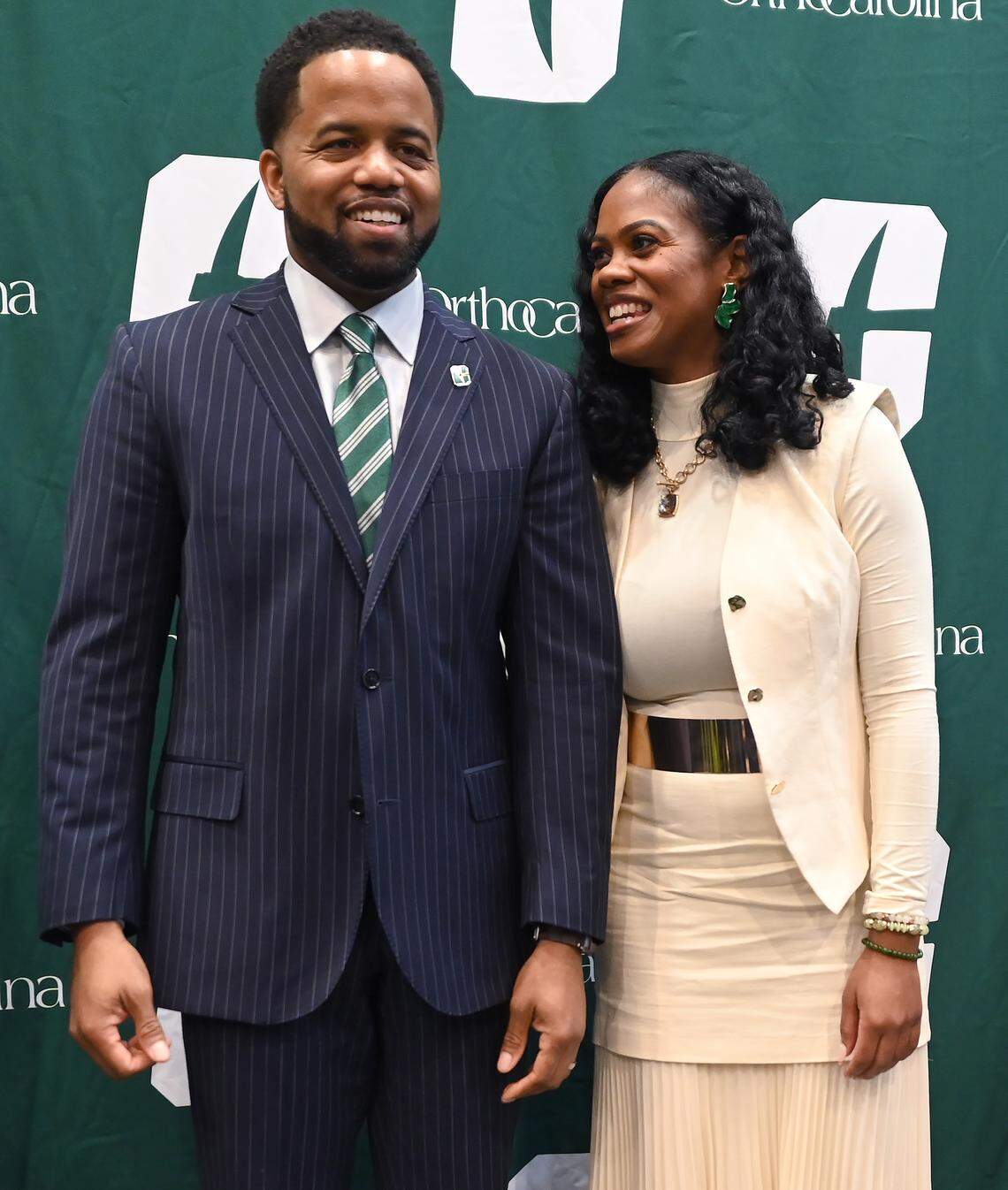 New Charlotte 49ers athletic director Kevin White and his wife, Jari, enjoy a quick moment together following his introductory news conference Thursday.
