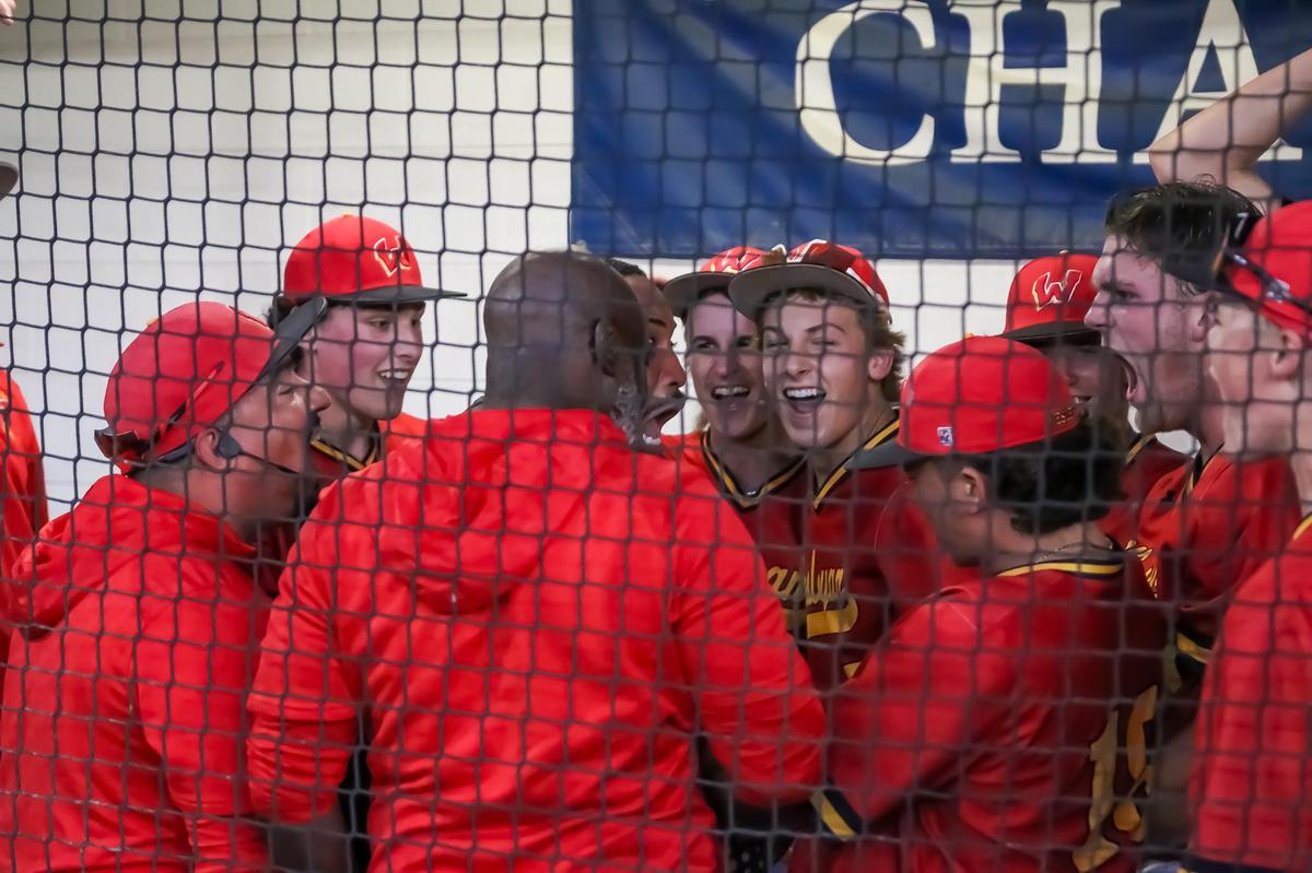 Wesleyan Christian team and coaches celebrate from the dugout after a game-winning finish Charlotte Christian in theNCISAA state semifinals on May 14th, 2025 in Charlotte, NC