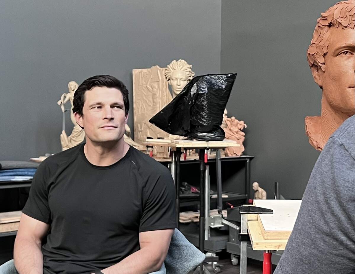 Sculptor Ben Hammond works on the sculpture of former Carolina Panthers star Luke Kuechly in May 2026. While Hammond’s original sculpture is made with clay, a finished and bronzed version of the sculpture will be exhibited at the Pro Football Hall of Fame following Kuechly’s enshrinement in August.