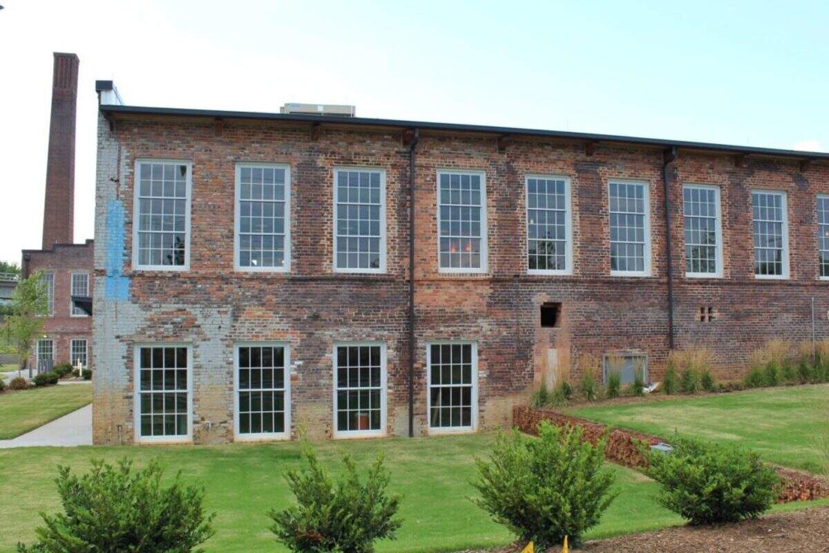 The Optimist Hall site, shown in 2019, was once a textile mill and is now home to a food hall, retail and office space.