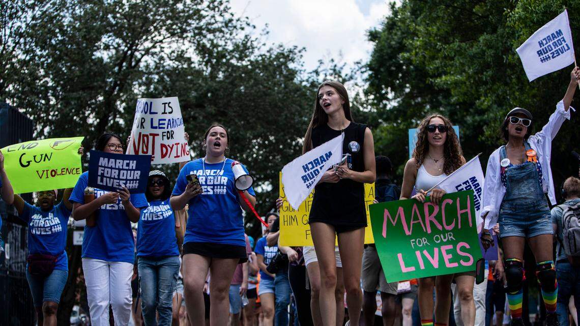 Hundreds of people marched down East 7th Street to rally for more gun regulations in the face of recent national shootings in Charlotte, N.C., on June 12, 2022.