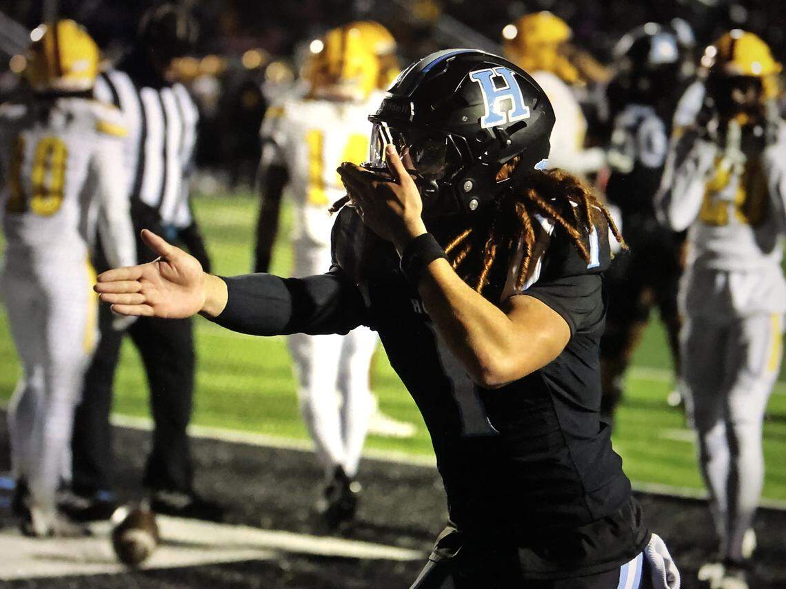 Hough QB Ethan Royal celebrates after scoring during Friday’s NCHSAA 8A state semifinal at Hough on November 28, 2025