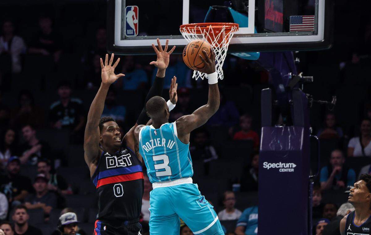 Charlotte Hornets guard Terry Rozier, right, shoots over Detroit Pistons center Jalen Duren at the Spectrum Center in Charlotte, N.C., on Friday, October 27, 2023. Rozier had 20 points for Charlotte in an 111-99 loss, while Duren had a game-high 17 rebounds.