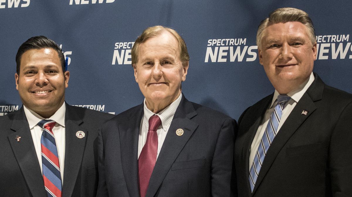 The 9th District’s Republican candidates – from left, Clarence Goins, Robert Pittenger and Mark Harris – meet to debate on 
Thursday, April 19, 2018.