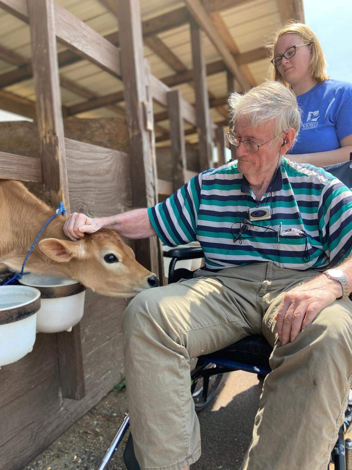 Charles Austin pets a calf at the Riverbend Creamery dairy farm in Lincolnton. Austin, a resident of the Abernethy Laurels nursing home in Newton, N.C., grew up on a dairy farm. And he got to go to Riverbend Creamery as part of the nursing home’s “Grant a Dream’ program.