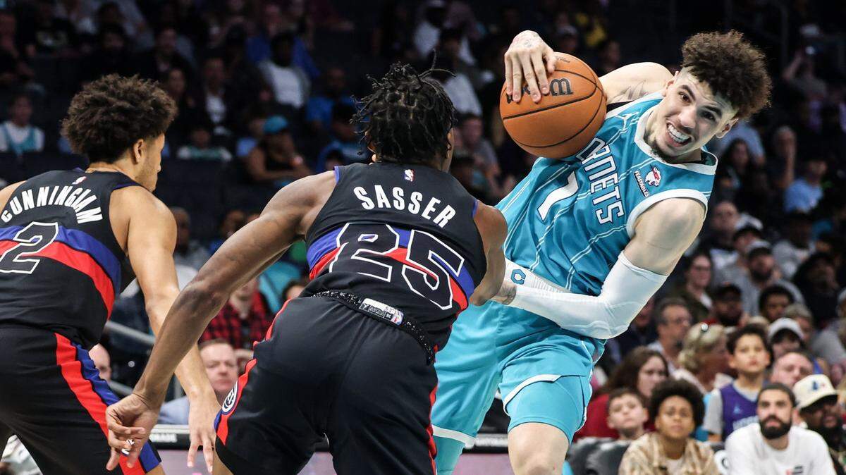 Charlotte Hornets guard LaMelo Ball, right, fights for the ball with Detroit Pistons guard Marcus Sasser at the Spectrum Center in Charlotte, N.C., on Friday, October 27, 2023. Detroit won, 111-99.